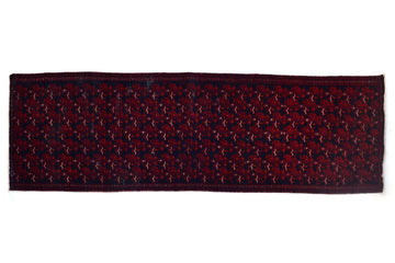 Patterned rug with a geometric design on a white background