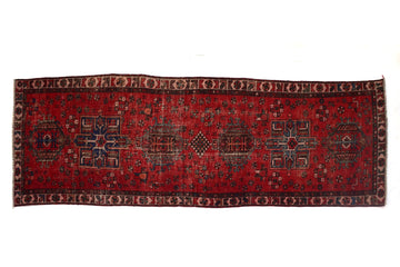 Red patterned rug on a white background