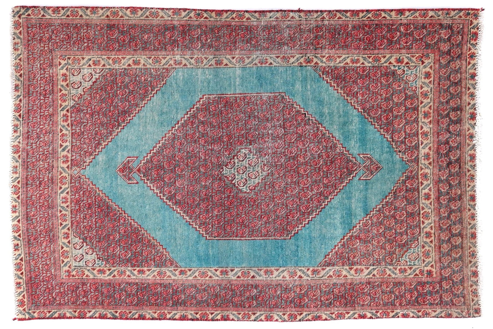 Decorative rug with a geometric pattern on a white background