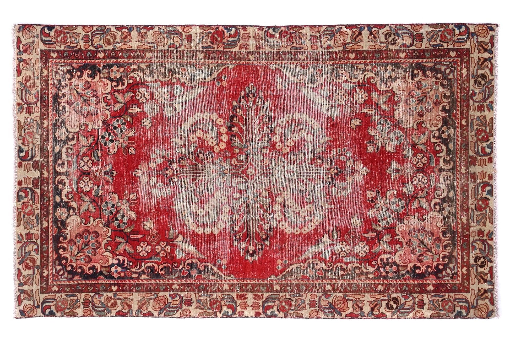Decorative red and beige rug with intricate patterns on a white background