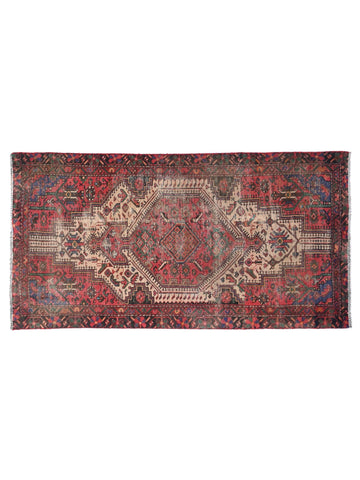 Vintage rug with intricate patterns on a white background