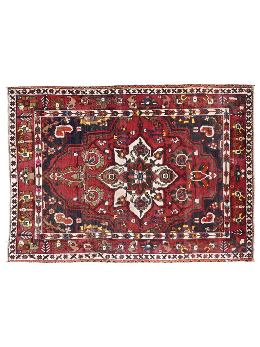 Decorative rug with intricate patterns on a white background