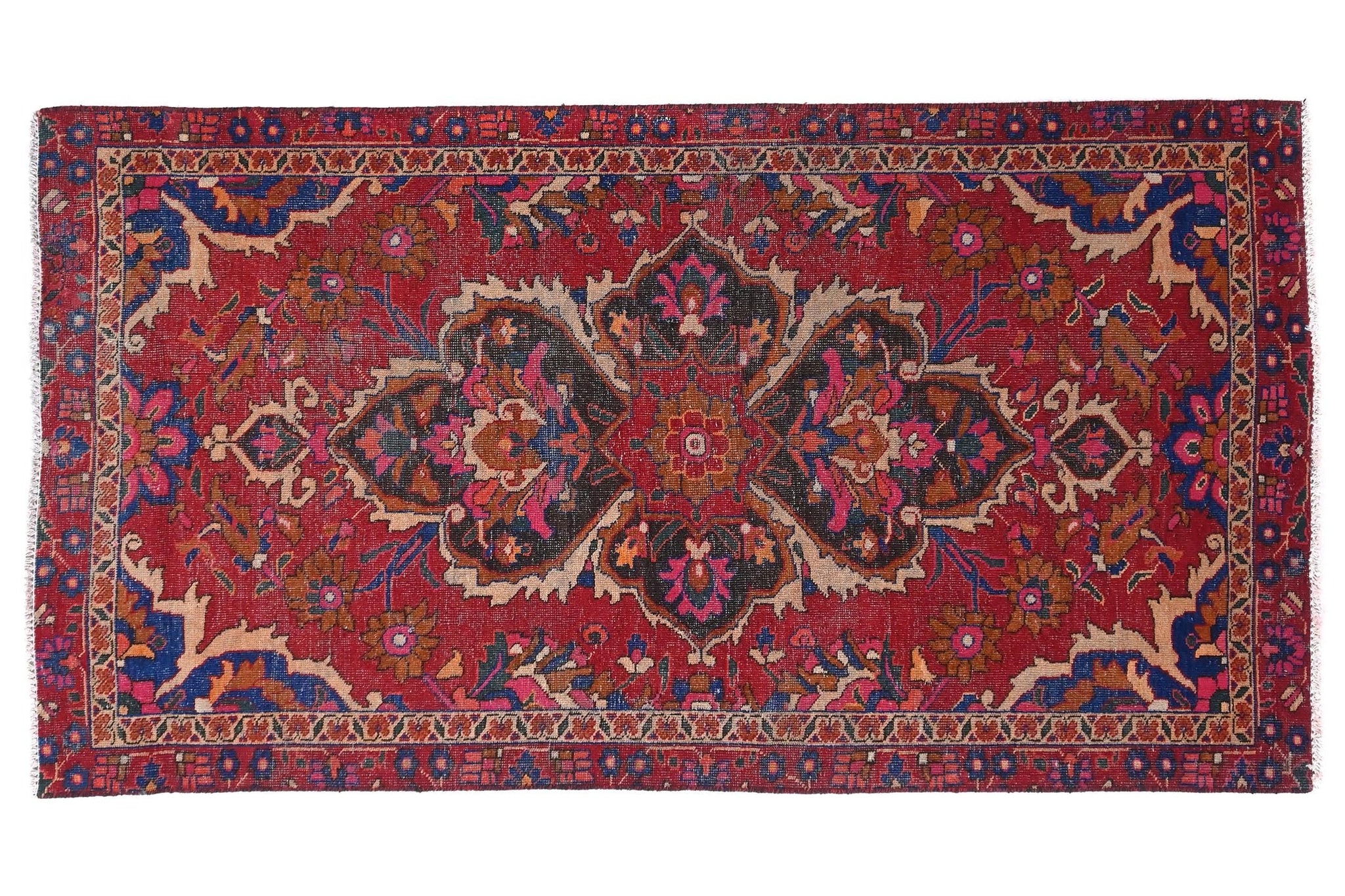 Decorative red rug with intricate patterns on a white background