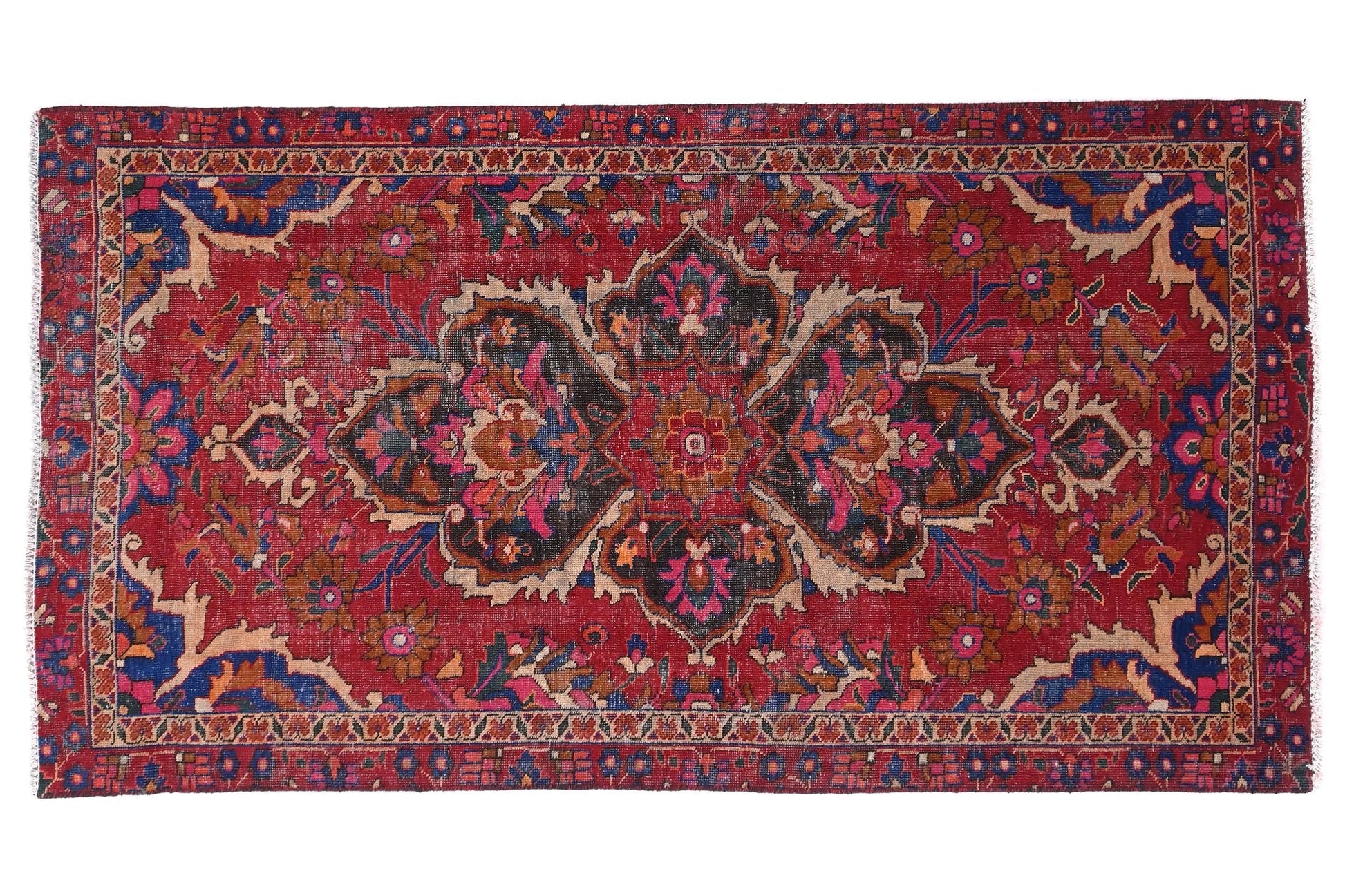 Decorative red rug with intricate patterns on a white background