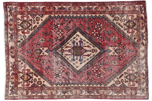 Decorative rug with intricate patterns on a white background