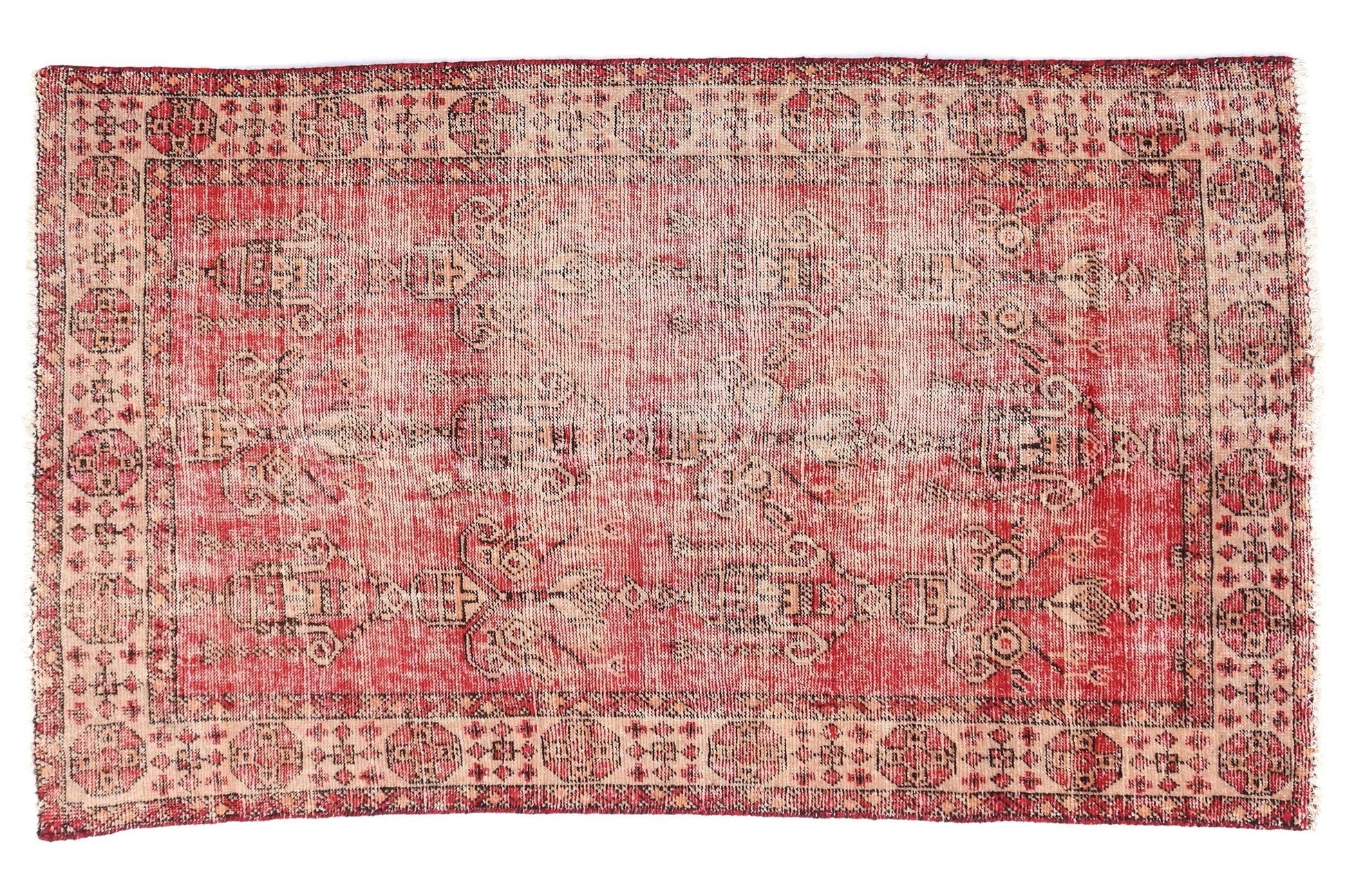 Vintage-style rug with red and beige pattern on a white background