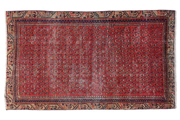 Red patterned rug on a white background