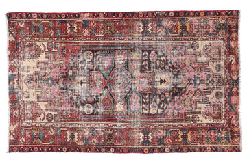 Vintage-style rug with intricate patterns on a white background
