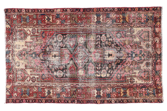 Vintage-style rug with intricate patterns on a white background