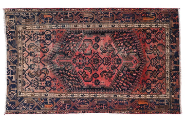 Decorative rug with intricate patterns on a white background