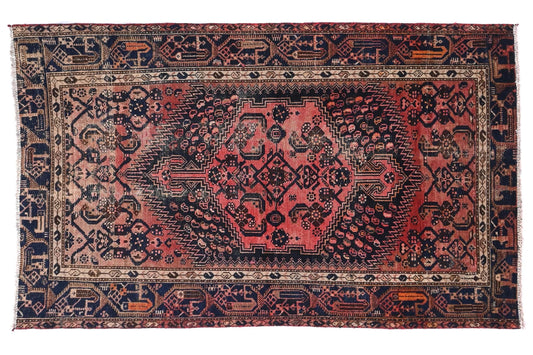 Decorative rug with intricate patterns on a white background