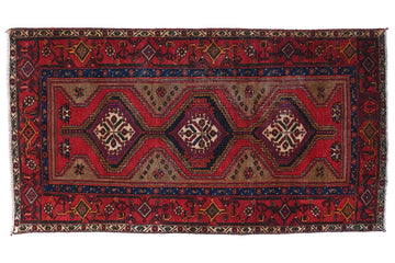 Decorative rug with intricate patterns on a white background