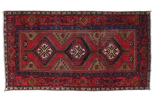 Decorative rug with intricate patterns on a white background
