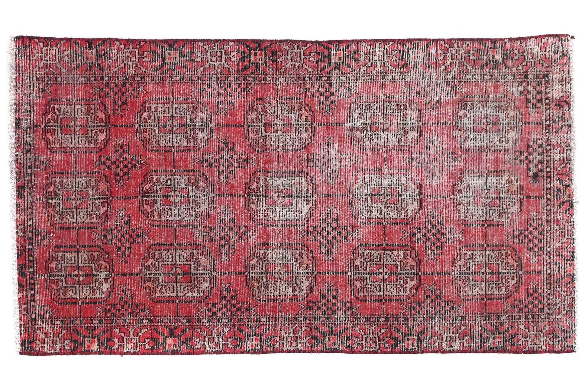 Red patterned rug on a white background
