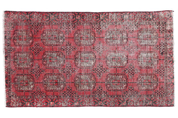 Red patterned rug on a white background