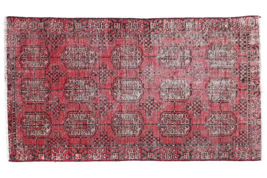Red patterned rug on a white background