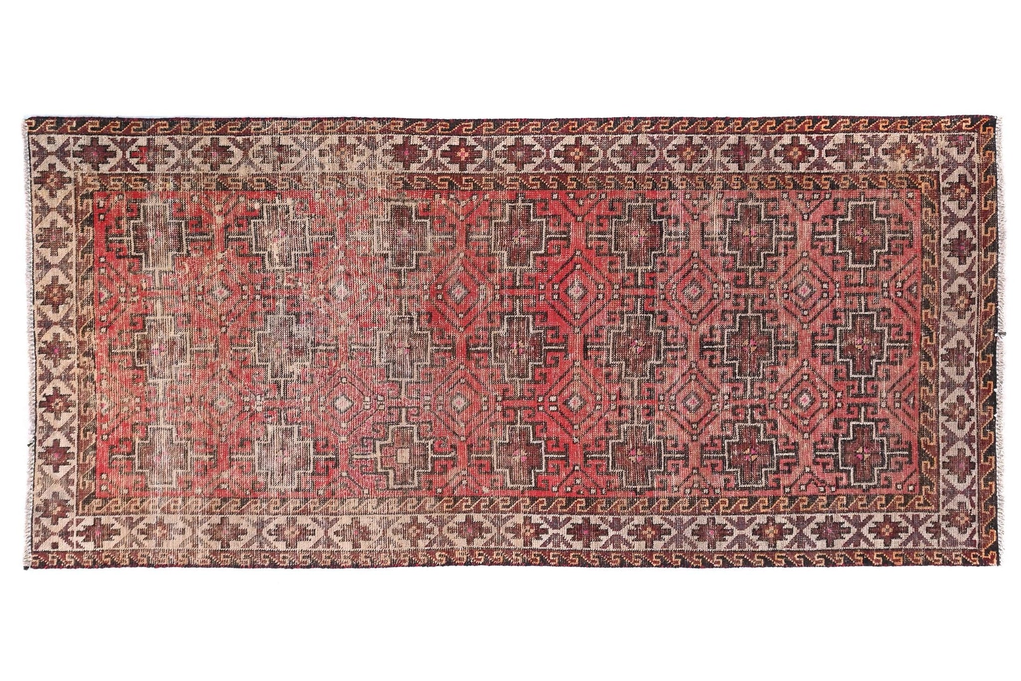 Decorative rug with intricate patterns on a white background
