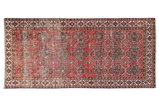 Decorative rug with intricate patterns on a white background