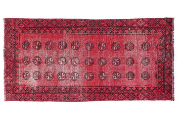 Red patterned rug on a white background