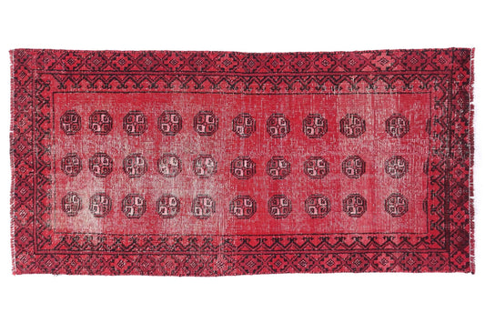 Red patterned rug on a white background