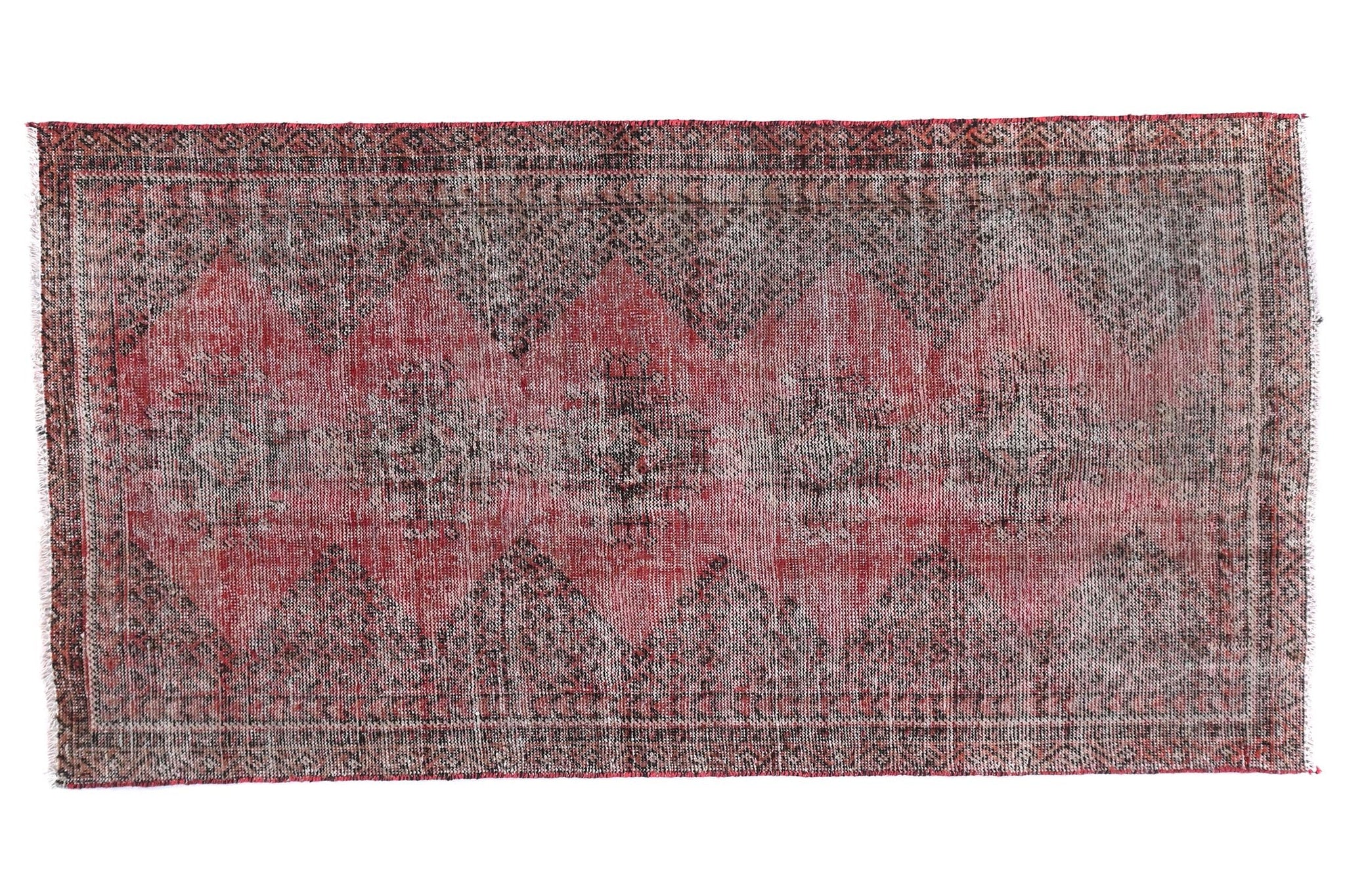 Rectangular rug with a patterned design on a white background