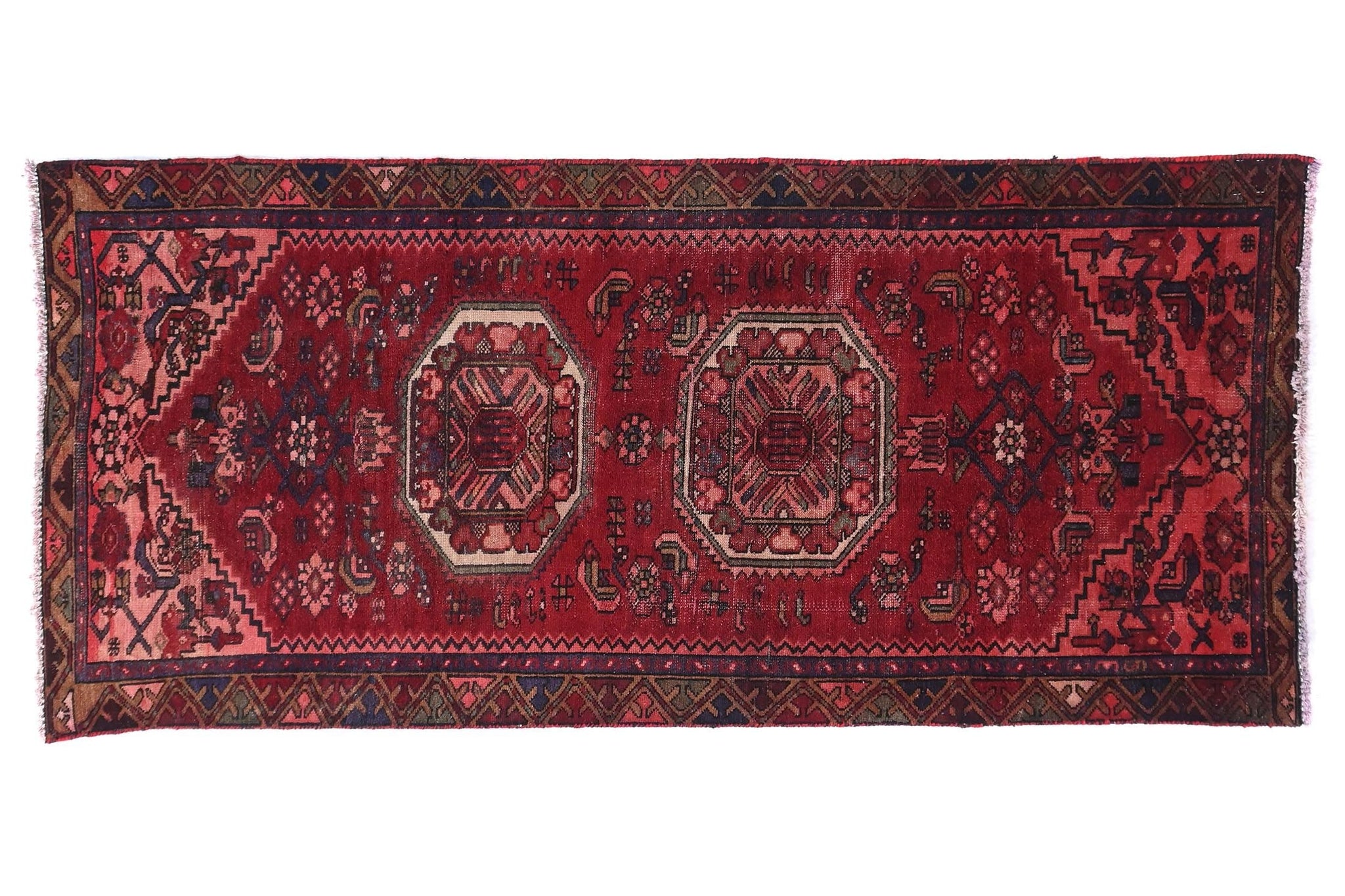 Red patterned rug on a white background