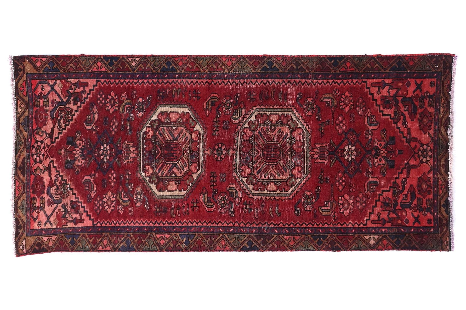 Red patterned rug on a white background