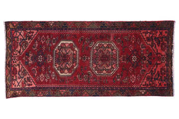 Red patterned rug on a white background