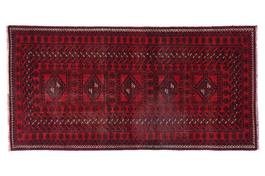 Red patterned rug on a white background
