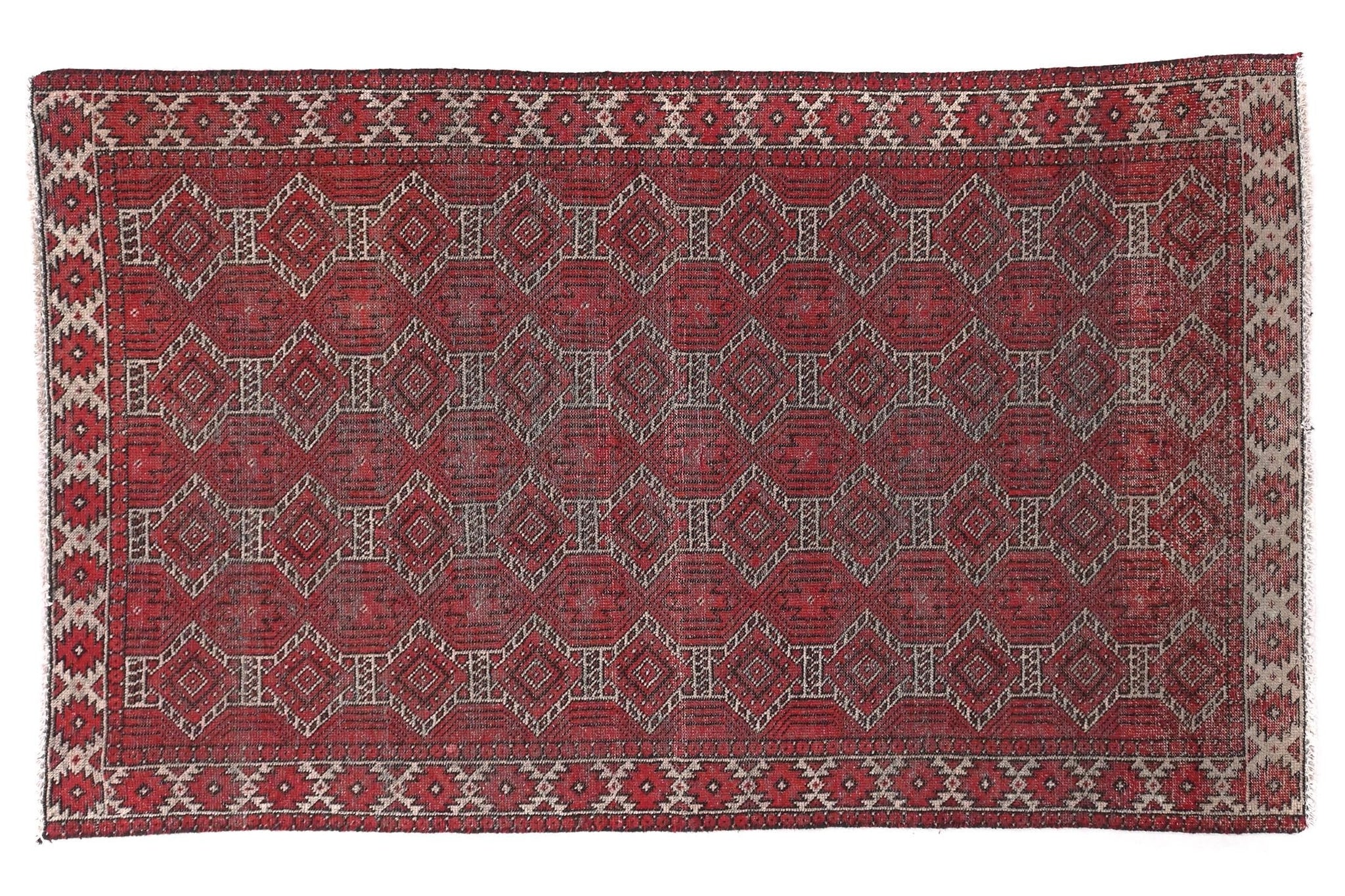 Red patterned rug on a white background