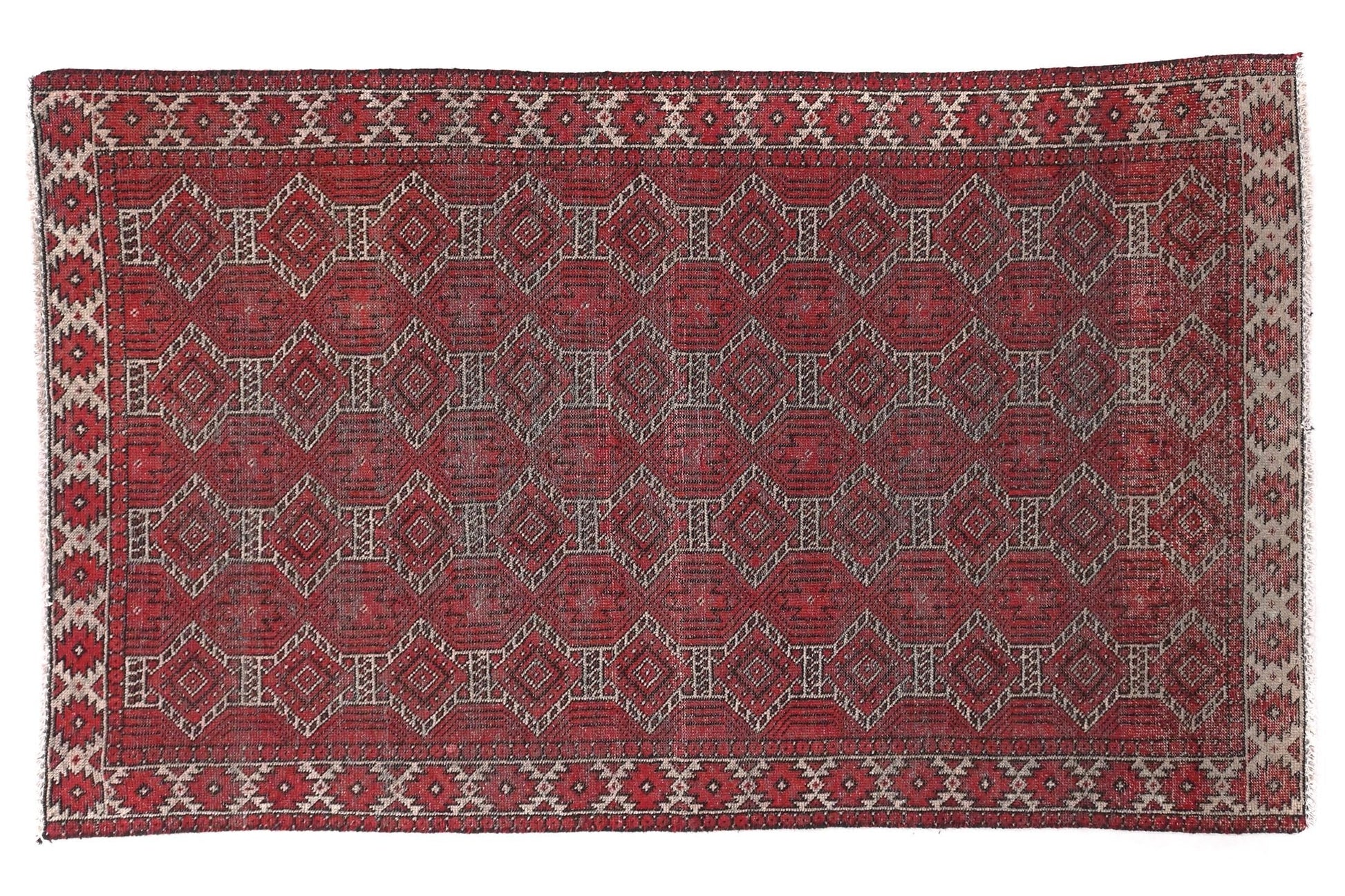 Red patterned rug on a white background