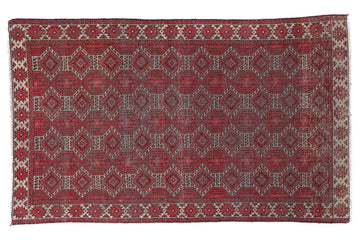 Red patterned rug on a white background