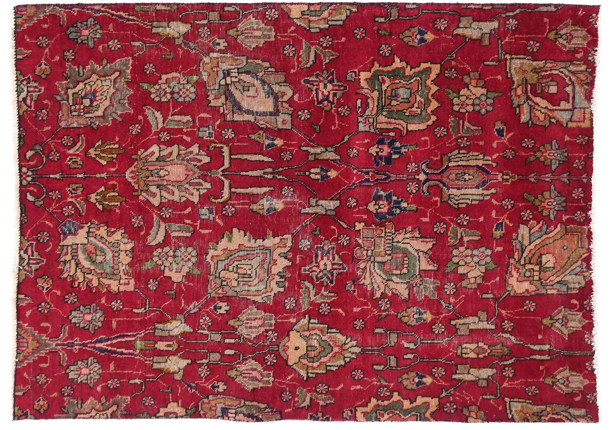 Red patterned rug with intricate designs on a white background