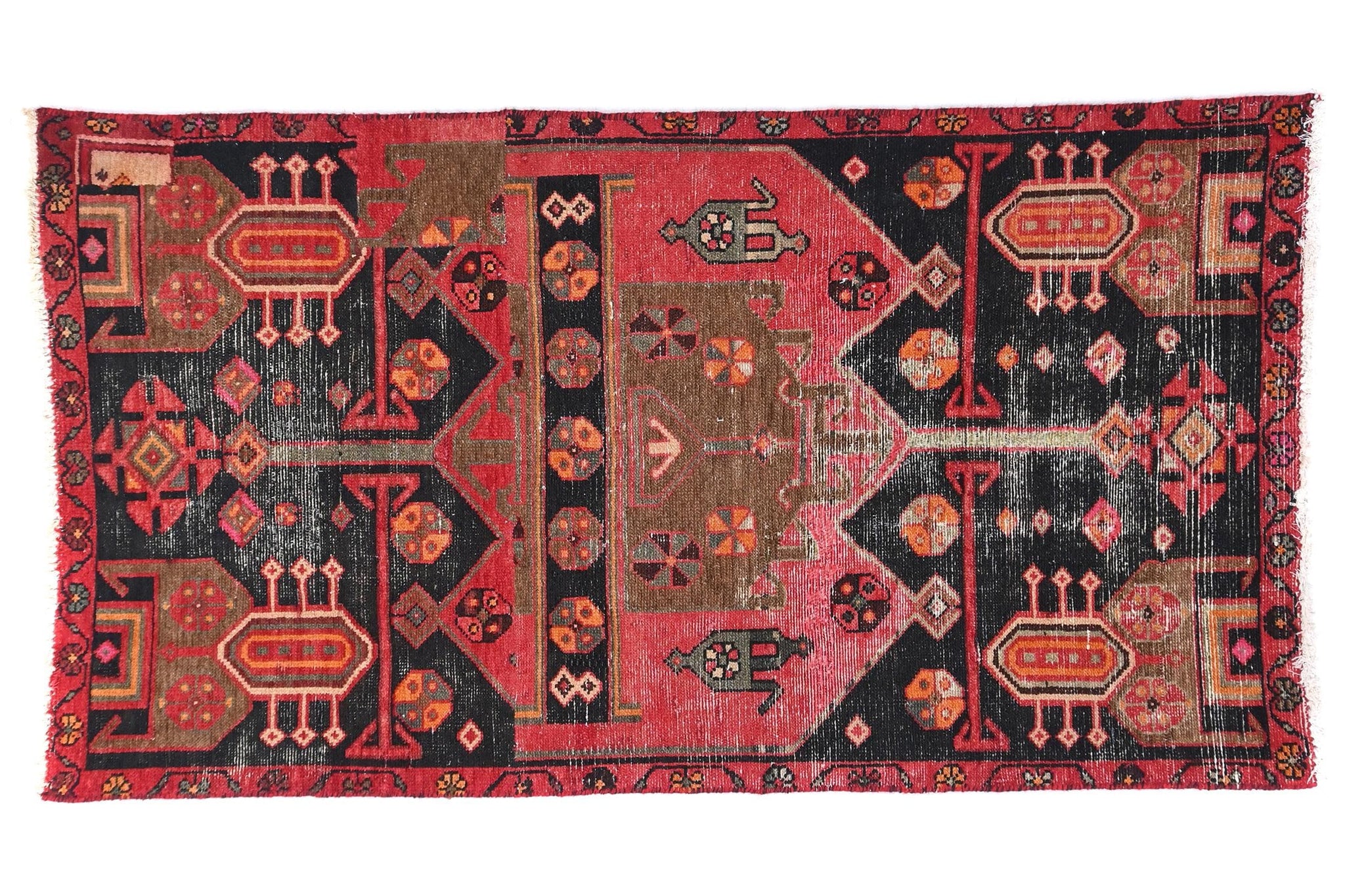 Decorative rug with intricate patterns on a white background