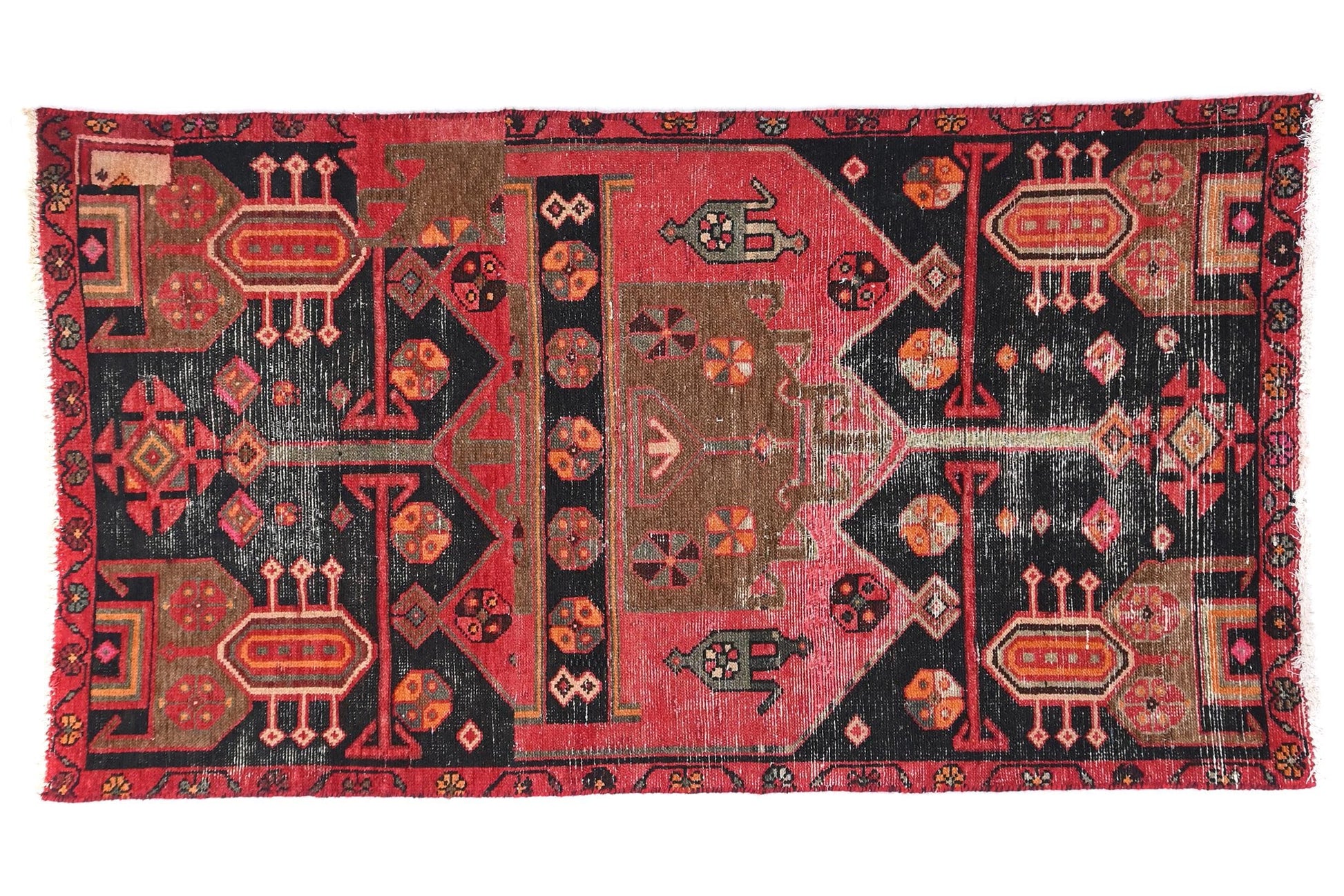 Decorative rug with intricate patterns on a white background