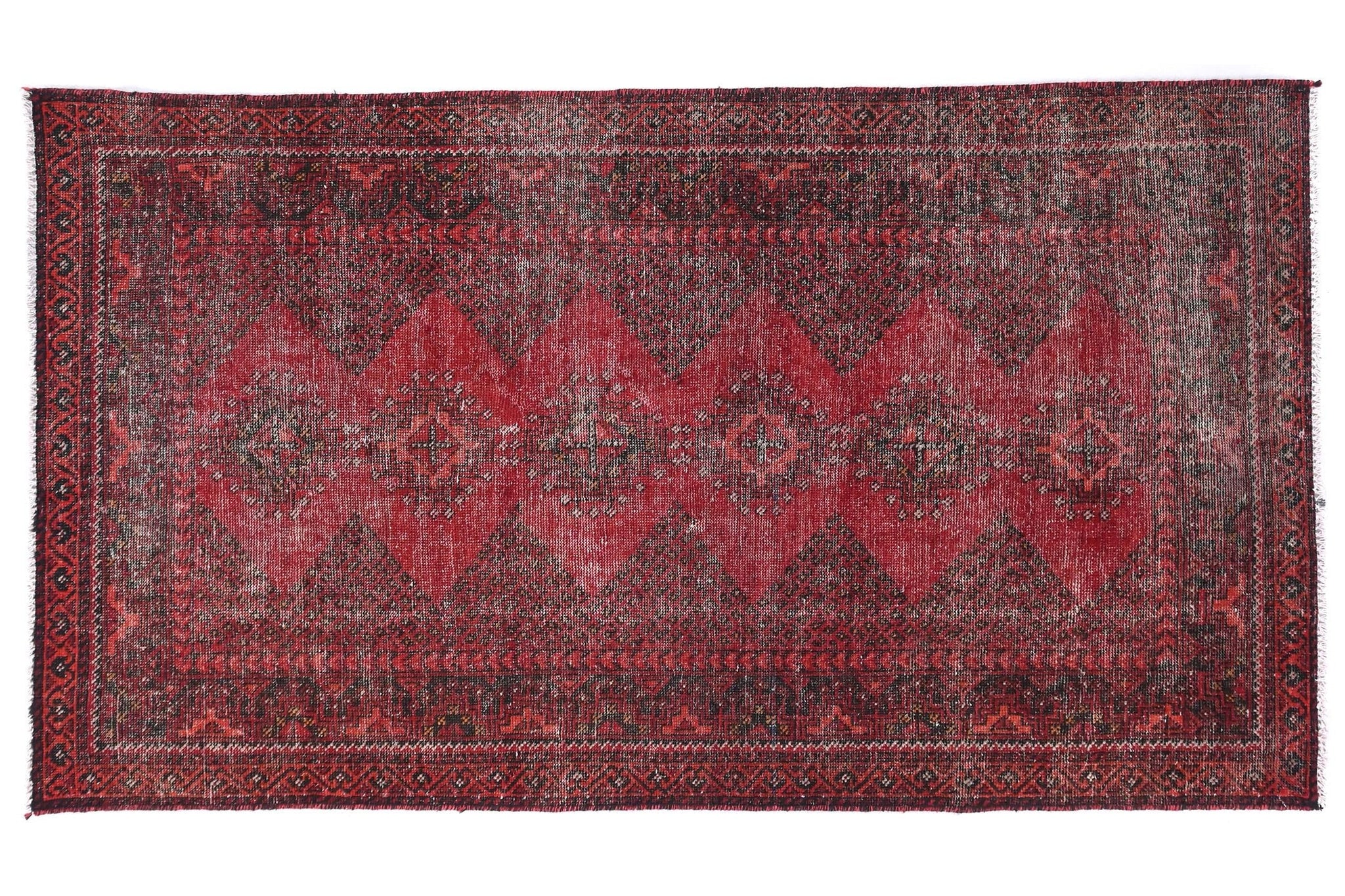 Red patterned rug on a white background