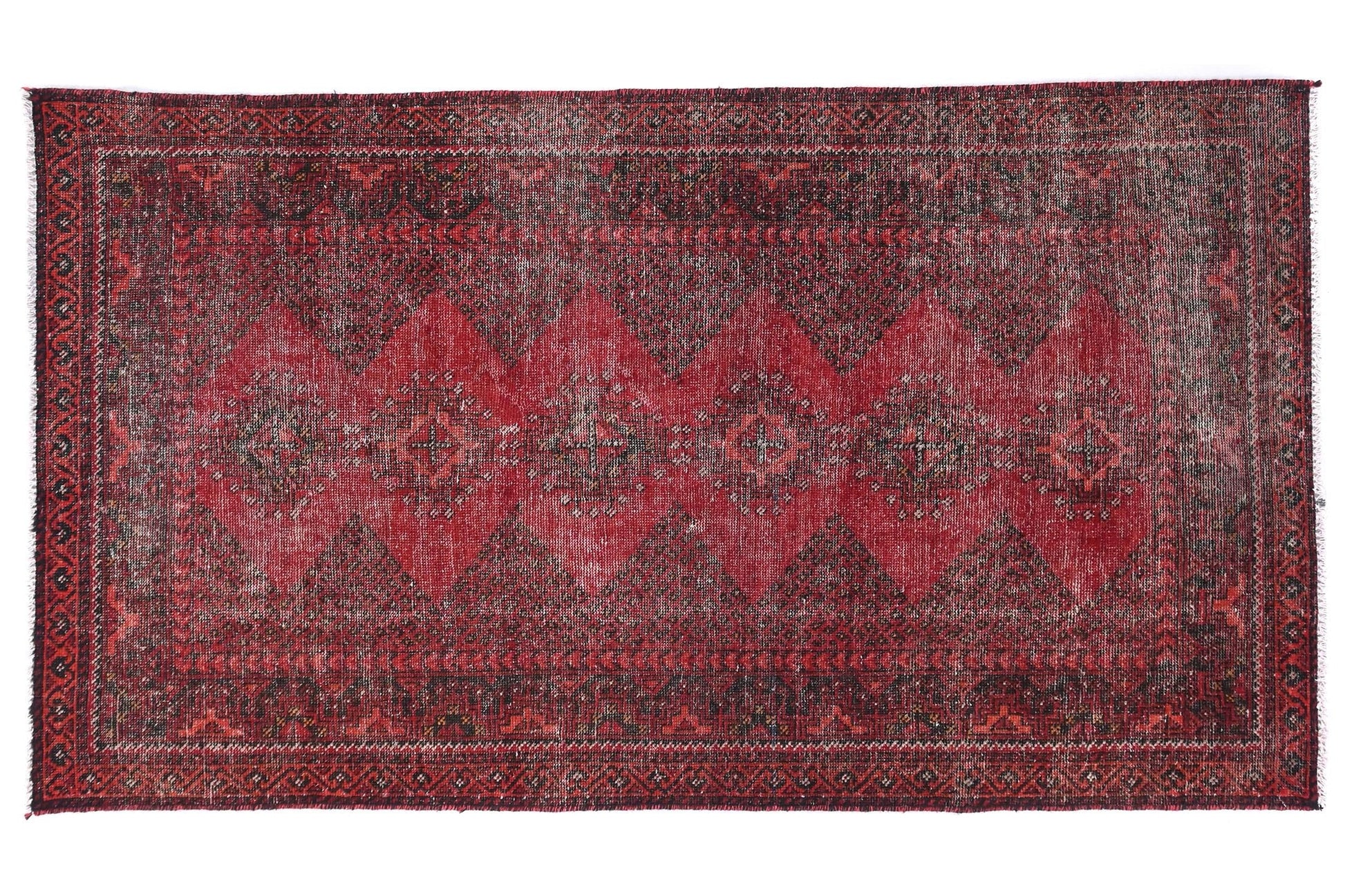 Red patterned rug on a white background