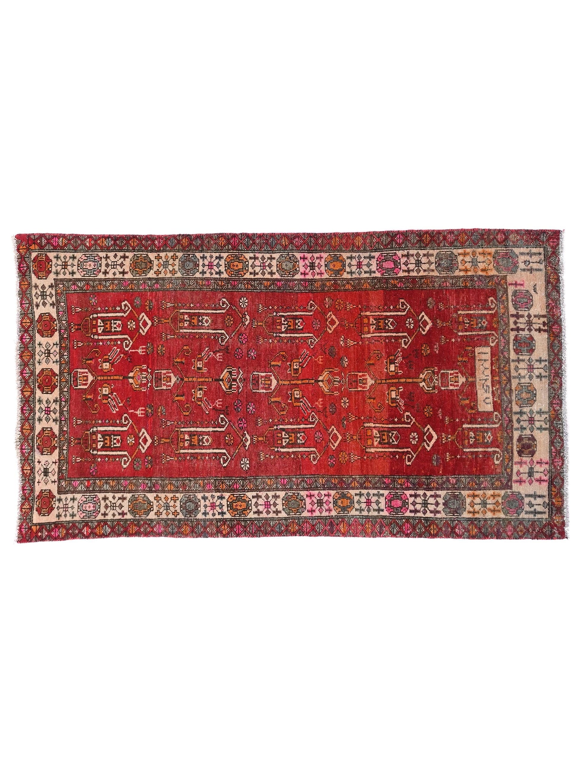 Red patterned rug with intricate designs on a white background