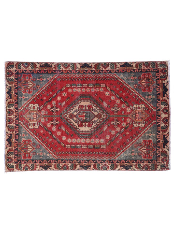 Decorative rug with intricate patterns on a white background