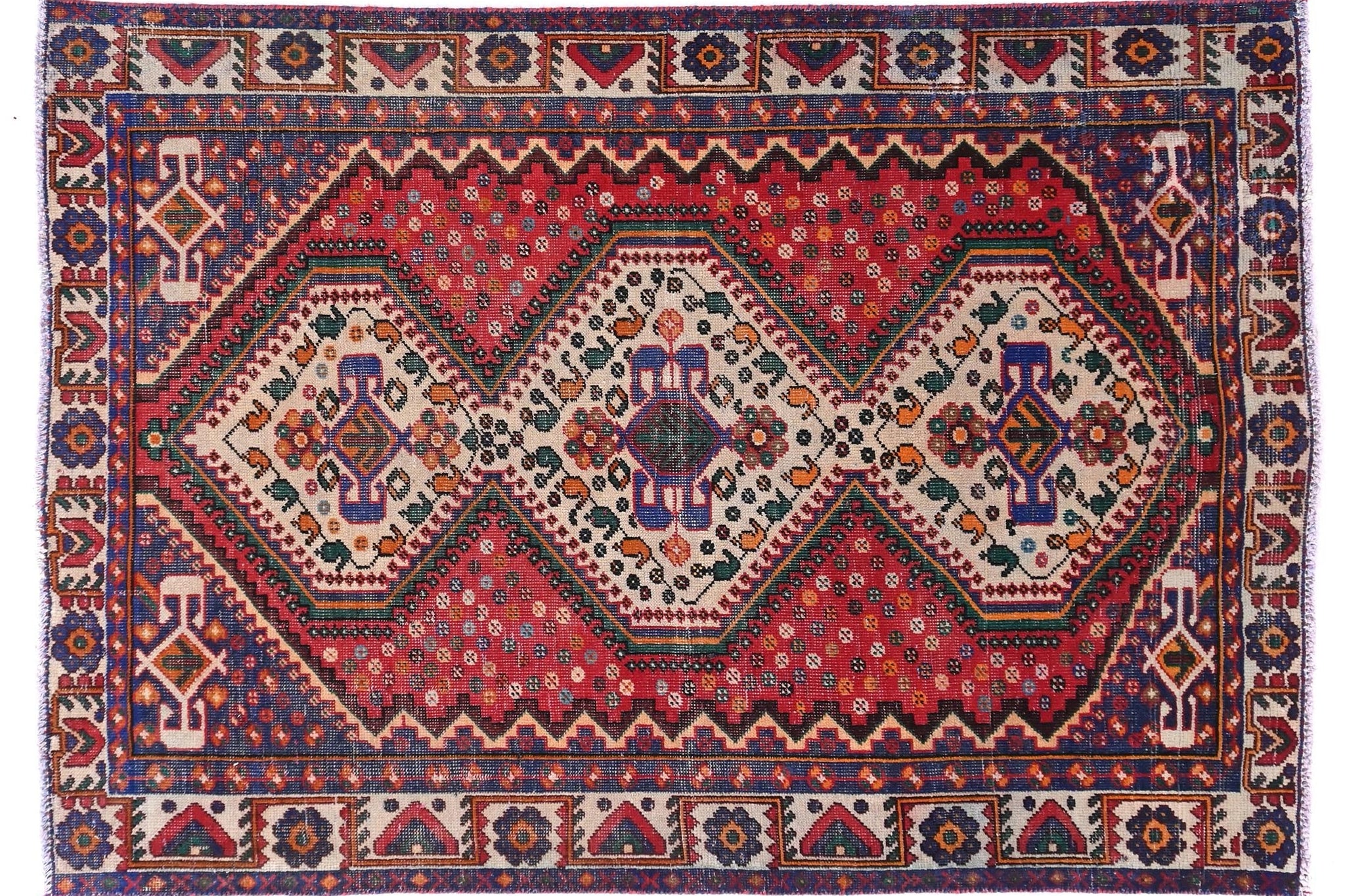 Decorative rug with intricate patterns on a white background