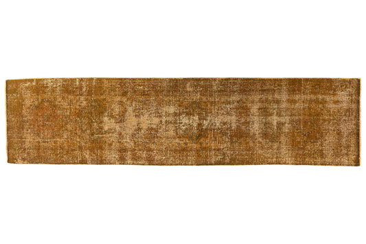 Long, narrow brown rug on a white background