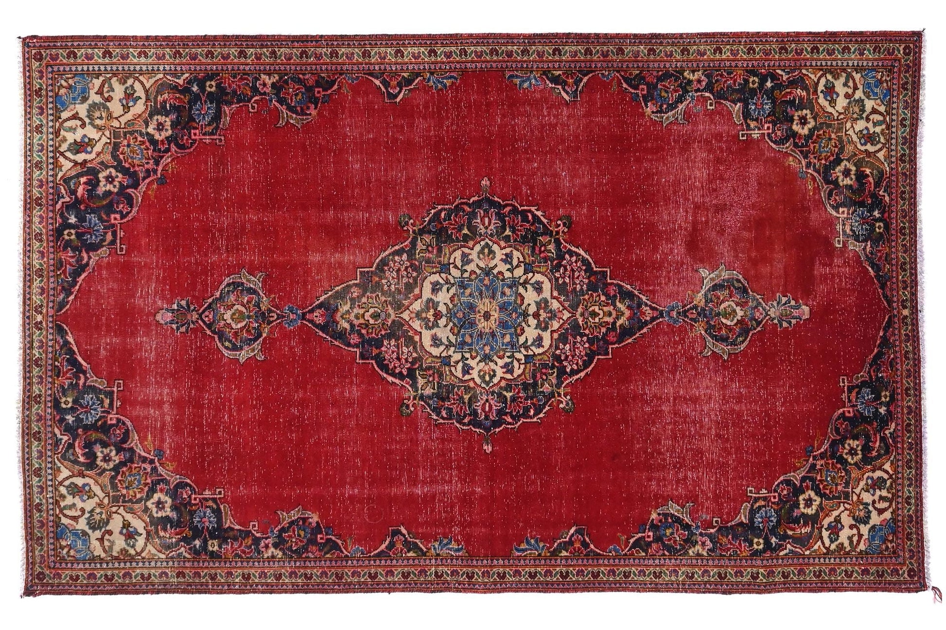 Decorative red rug with intricate patterns on a white background