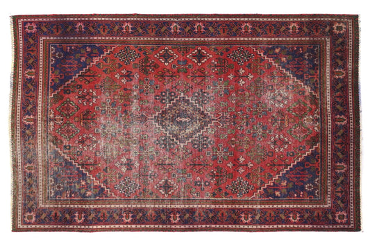 Decorative rug with intricate patterns on a white background