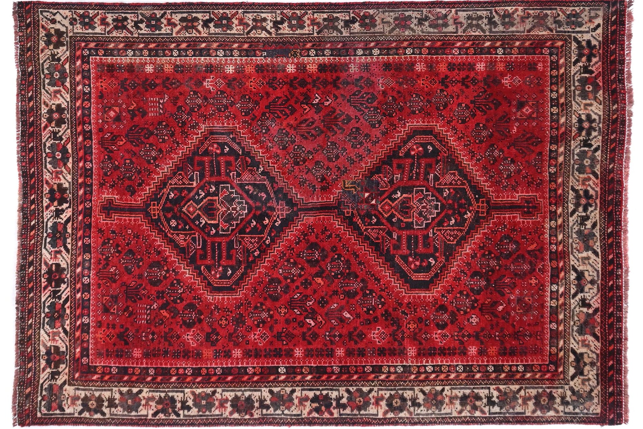 Red patterned rug on a white background