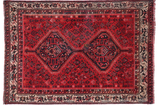 Red patterned rug on a white background