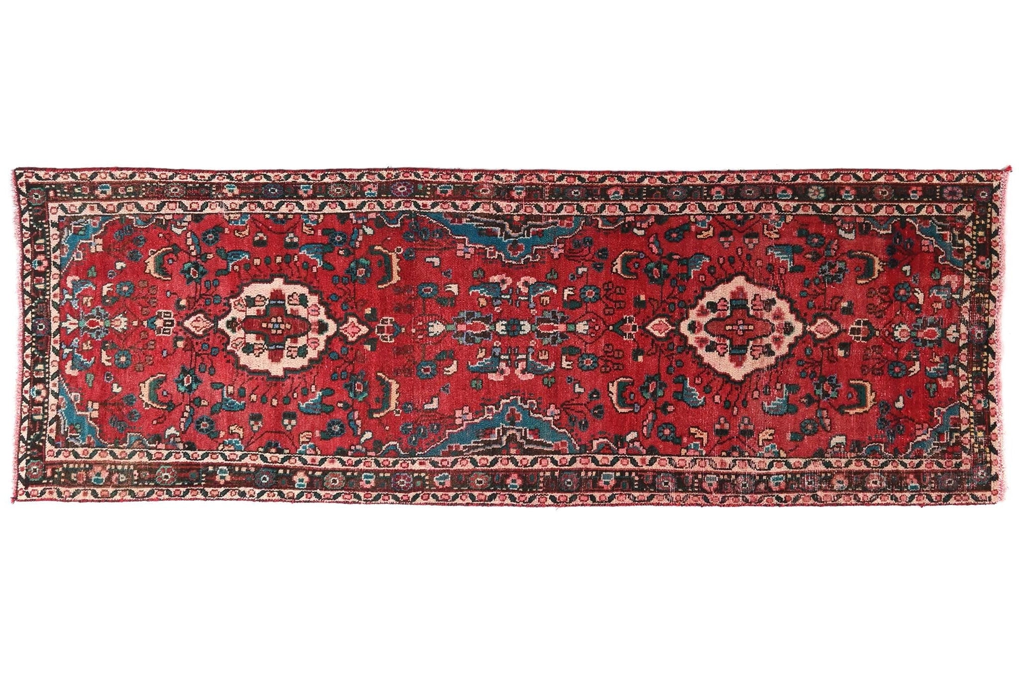 Red patterned rug on a white background