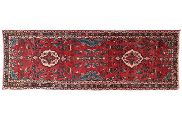 Red patterned rug on a white background