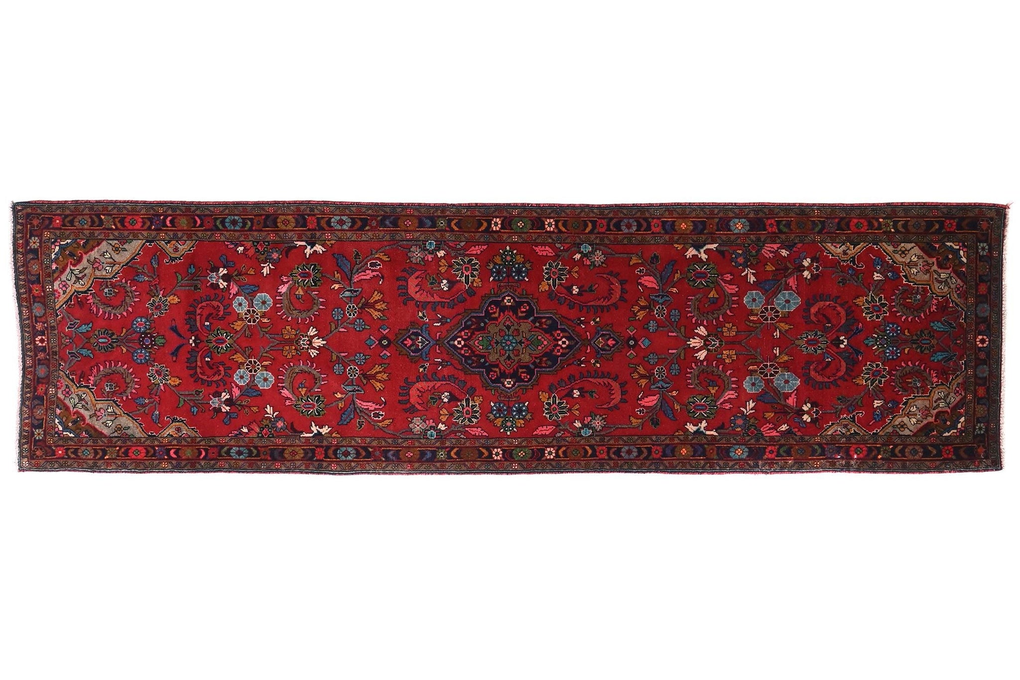 Red patterned rug on a white background