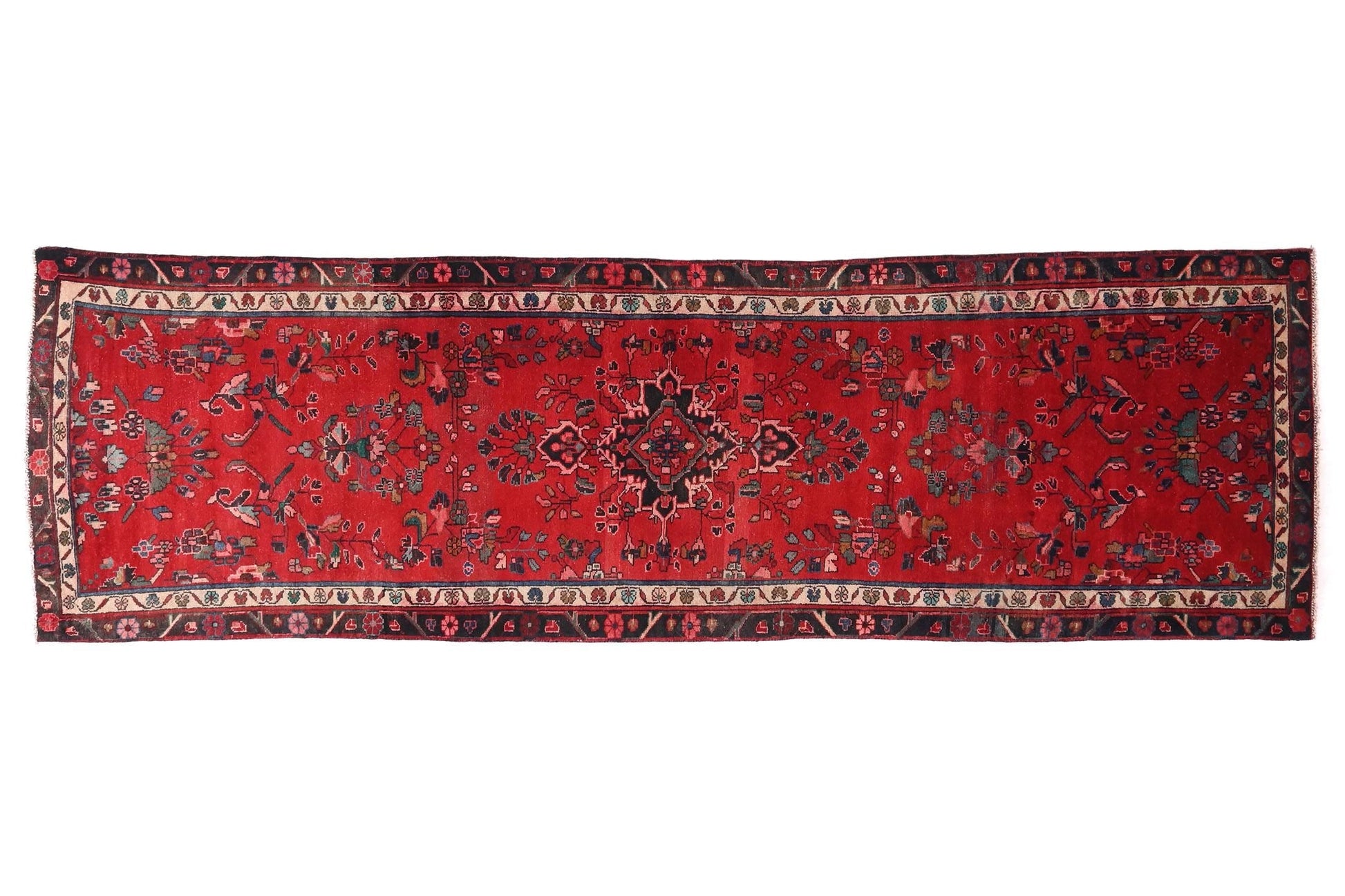 Red patterned rug on a white background