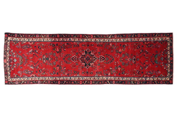 Red patterned rug on a white background